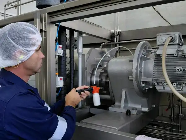 WearCheck onsite sampling technician Jaco de Beer takes sample from centrifugal pump