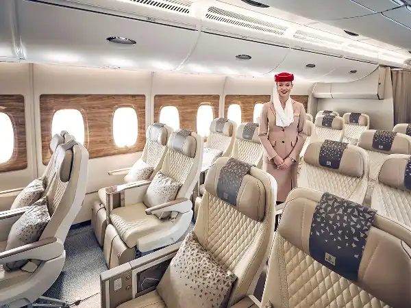 Emirates cabin crew standing in the Premium Economy cabin